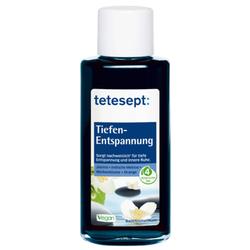 Eine blaue Flasche mit Badezusatz zur Tiefenentspannung steht aufrecht.
